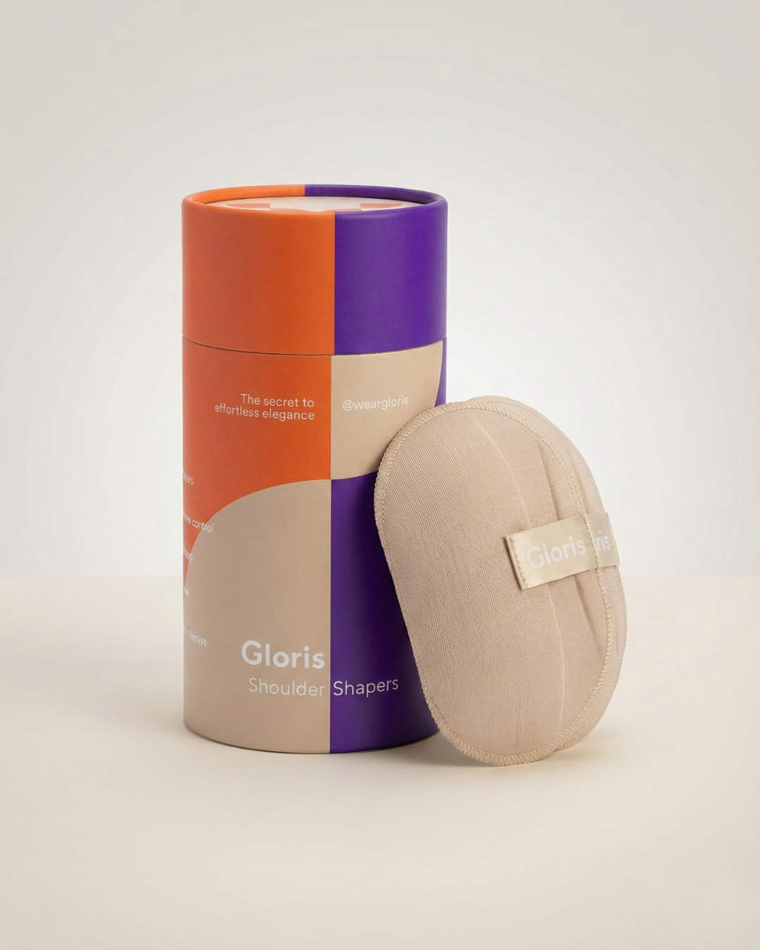 Gloris removable shoulder shaper in Nude beside its product packaging